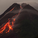 Lava flows down side of volcano
